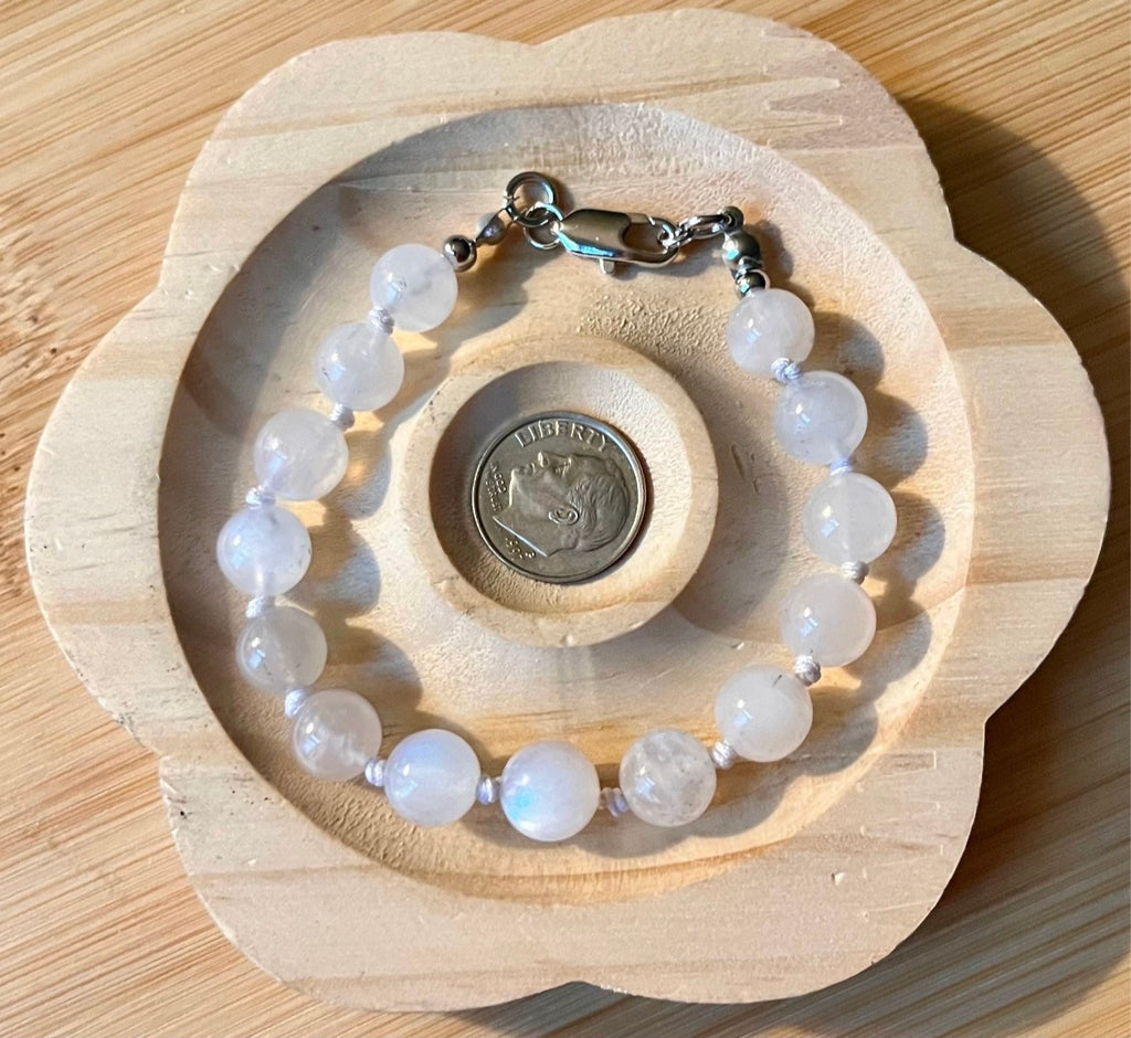 Glowing moonstone bracelet. High quality hand knotted 8mm moonstone bracelet with stainless steel or yellow gold plated stainless steel hardware!