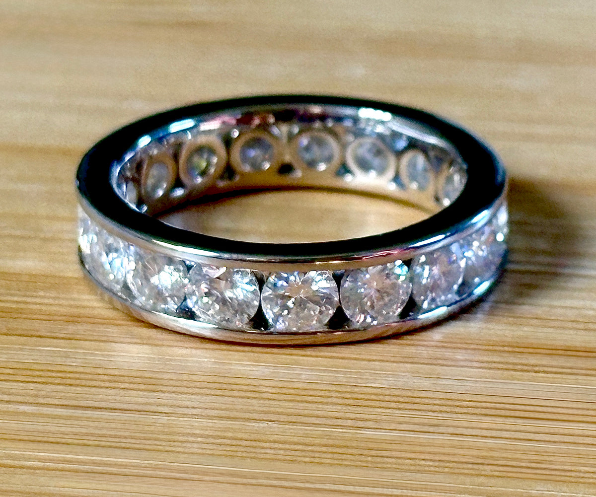 Moissanite ring. A 5.10cttw or 4.8cttw (depending on size) Moissanite eternity ring. A channel-set, classy and classic design - beautiful!