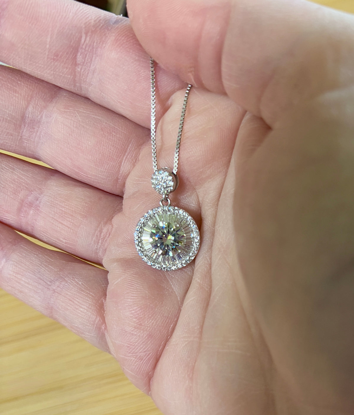 Moissanite necklace. The certified 2ct Moissanite “Sunburst” necklace with a 61 gemstone pendant plus more in the bail! Radiantly beautiful!