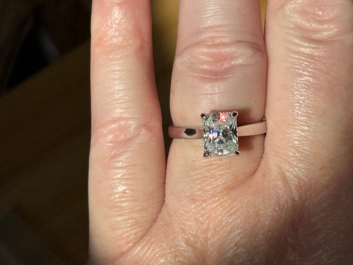 A certified Moissanite 3ct radiant solitaire! An UBER flashy, ULTRA classy, contemporary and chic radiant-cut engagement ring!