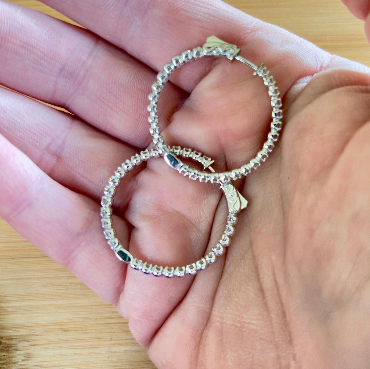 Moissanite hoops. These 1.8ctw Moissanite inside-out hoops *lock* in place so you can take your style from the office to the dance floor! So boogie down!