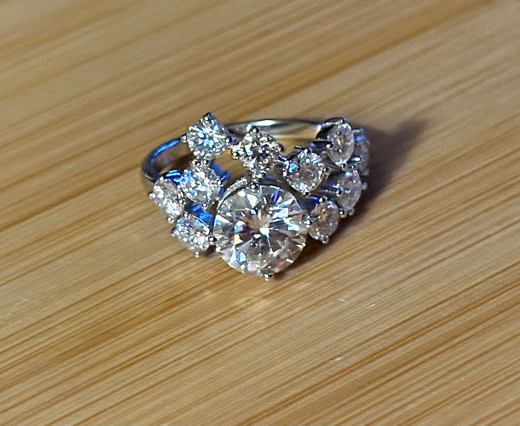 Moissanite ring. The “Moissanite Galaxy” ring features a 3ct certified Moissanite amid a 4cttw Moissanite constellation  - a 7cttw ring!