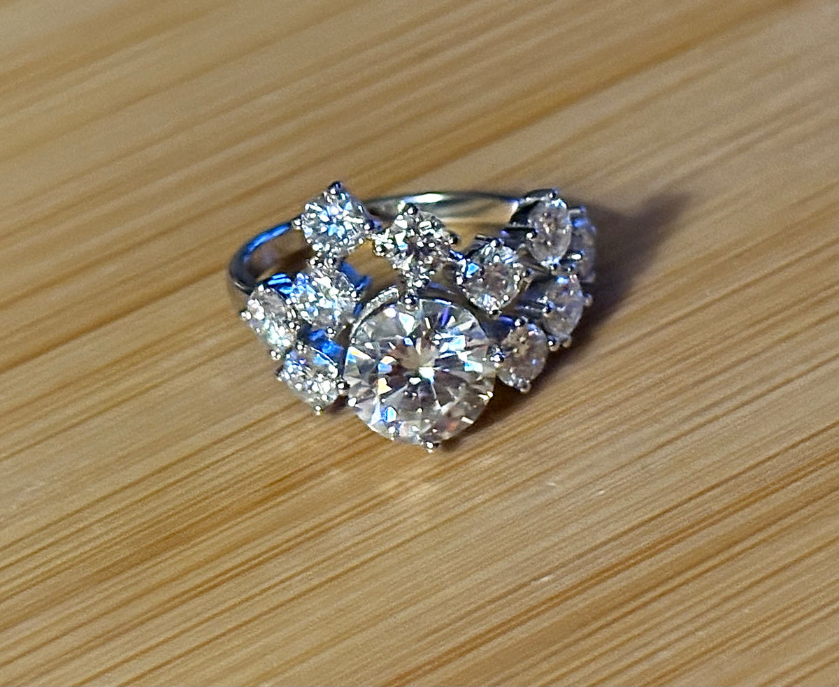 Moissanite ring. The “Moissanite Galaxy” ring features a 3ct certified Moissanite amid a 4cttw Moissanite constellation  - a 7cttw ring!
