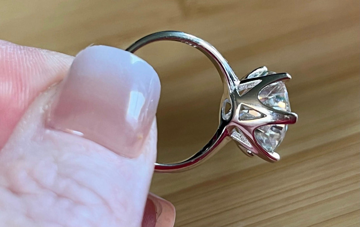 Moissanite ring. A gorgeous 10ct certified round brilliant Moissanite in a lovely crown setting, with 6 prongs and a sleek plain band!