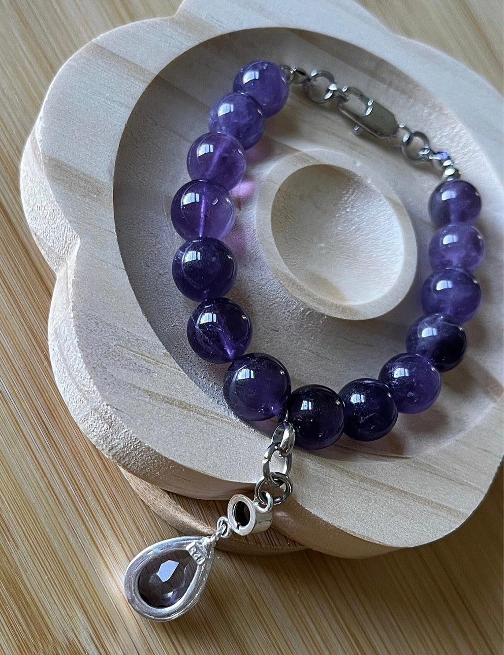 Amethyst bracelet. Natural and vibrant 10mm amethyst beads and stainless steel! The amethyst pendant in solid sterling silver is optional.