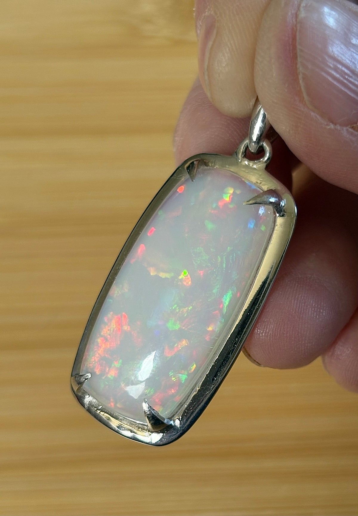 A 21ct AAA grade Ethiopian opal pendant, a handpicked opal and exclusive HKJ design! This lovely opal has gorgeous fire and play of color!