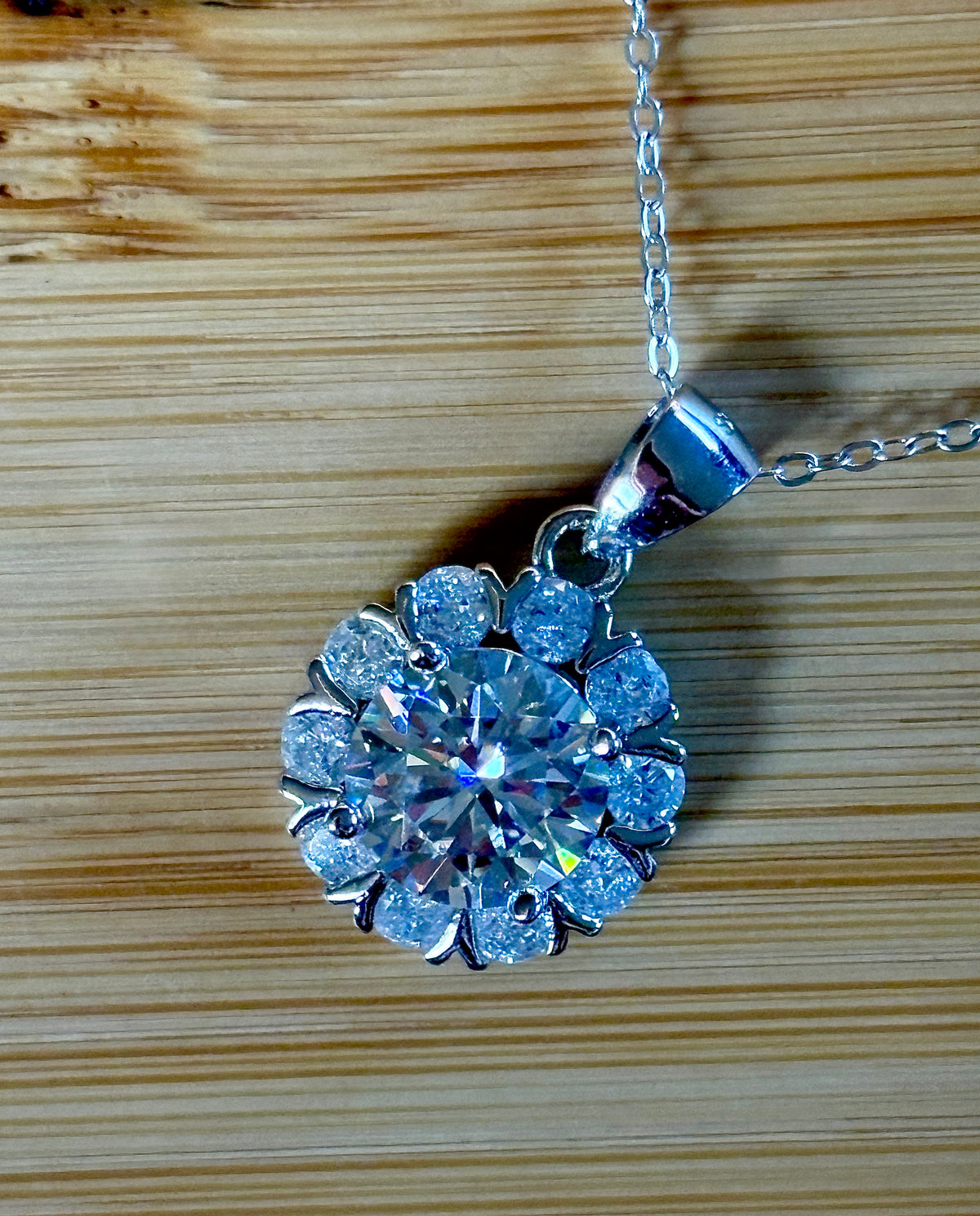 Moissanite necklace. A 3ct certified round brilliant Moissanite in a snowflake-shaped pendant ! A perfect piece for the holidays and beyond!