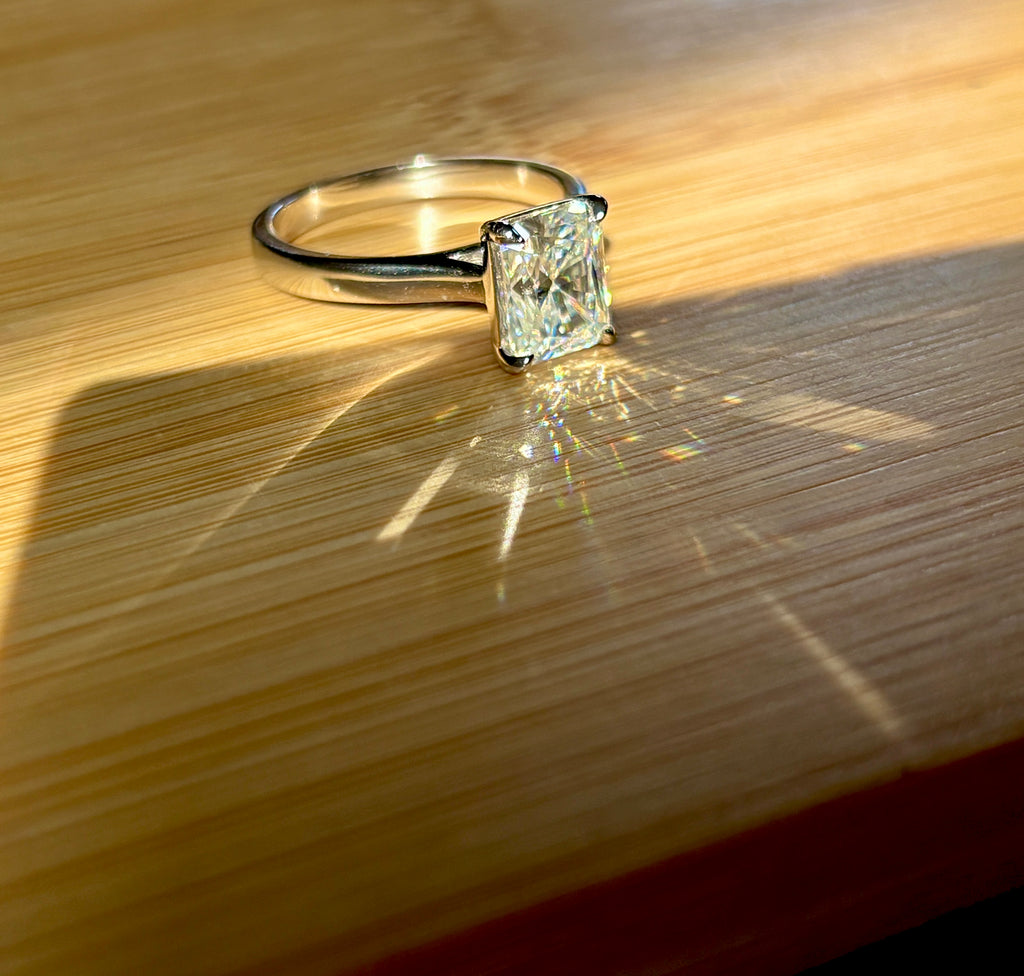 A certified Moissanite 3ct radiant solitaire! An UBER flashy, ULTRA classy, contemporary and chic radiant-cut engagement ring!