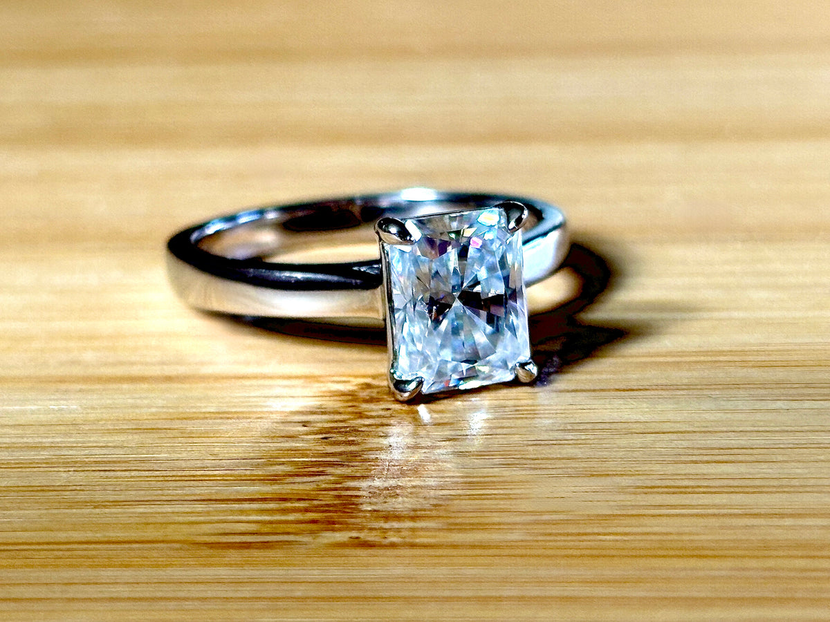 A certified Moissanite 3ct radiant solitaire! An UBER flashy, ULTRA classy, contemporary and chic radiant-cut engagement ring!