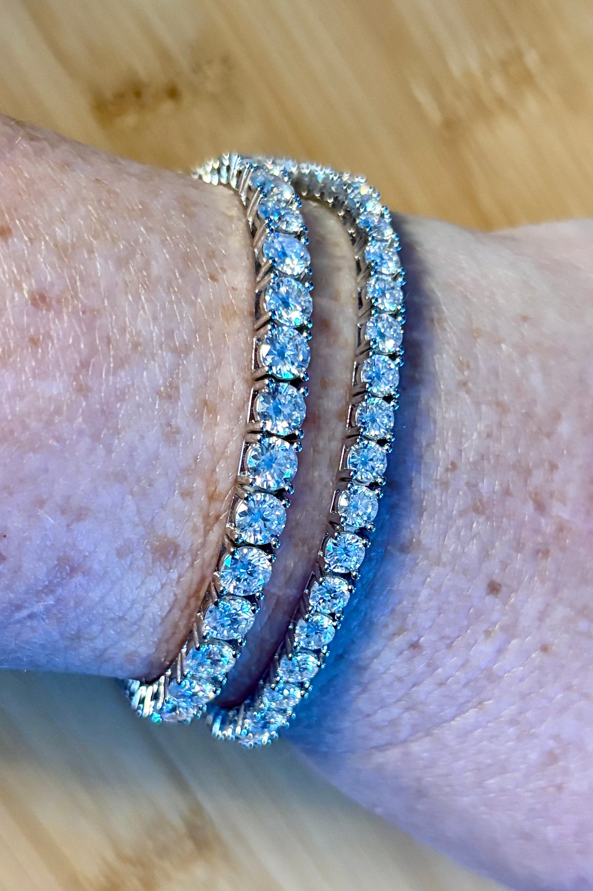 The certified “Ultimate Moissanite Tennis Bracelet” with masterful construction and “invisible” clasp in Argentium OR sterling silver!