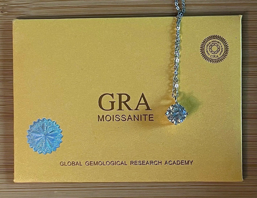 2ct Moissanite solitaire necklace. A 2ct “Floating Moissanite” in sterling silver creates the illusion of being suspended by nothing more than spider silk!