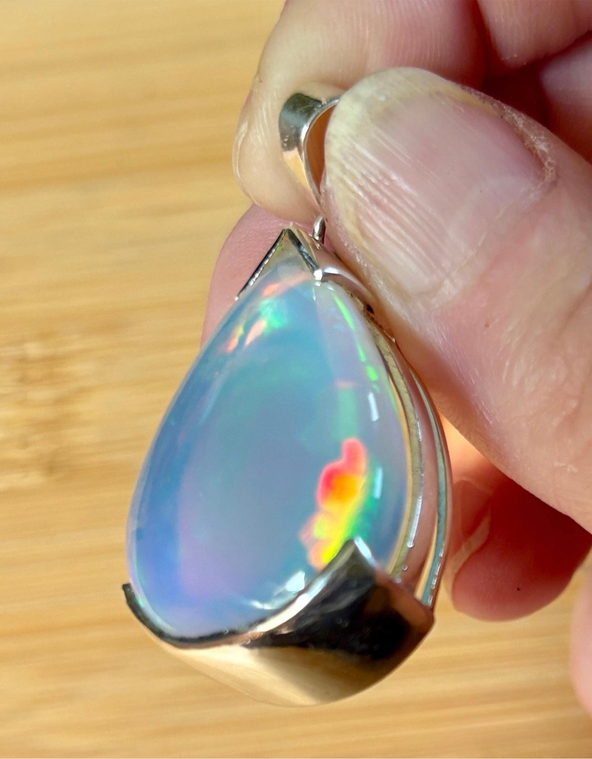 The “After the Storm” Ethiopian opal pendant, 39.18ct with rare “rolling” fire and spectacular play of color! **Collector’s grade** AAAA++