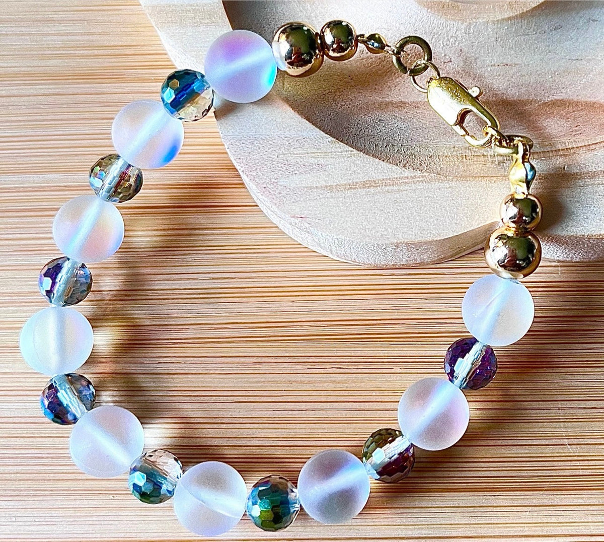 Austrian crystal bracelet with your choice of 6mm or 10mm frosted crystal beads, with golden or silvery stainless steel hardware.