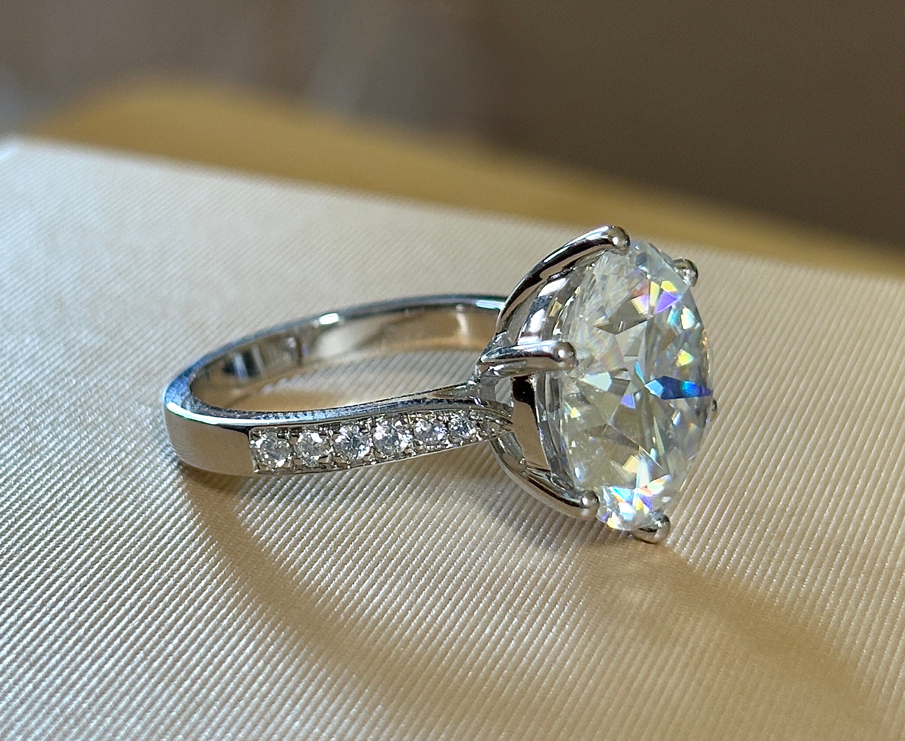 Moissanite ring. The 10ct certified 8H8A Moissanite “Tulip” statement ring with .50cttw Moissanite accents! Photos fail this GORGEOUS ring!