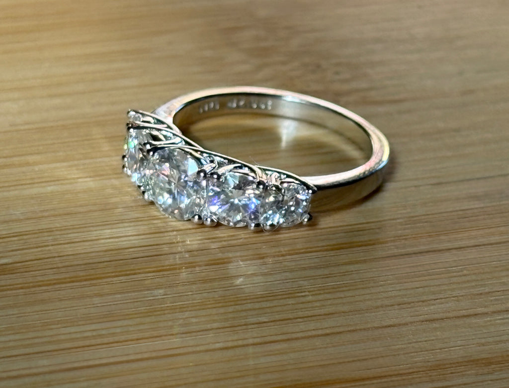 Moissanite ring. A 2.5ctw certified Moissanite ring, for those who want plenty of sparkle but a daintier ring! This feminine 5-stone design is just the thing!