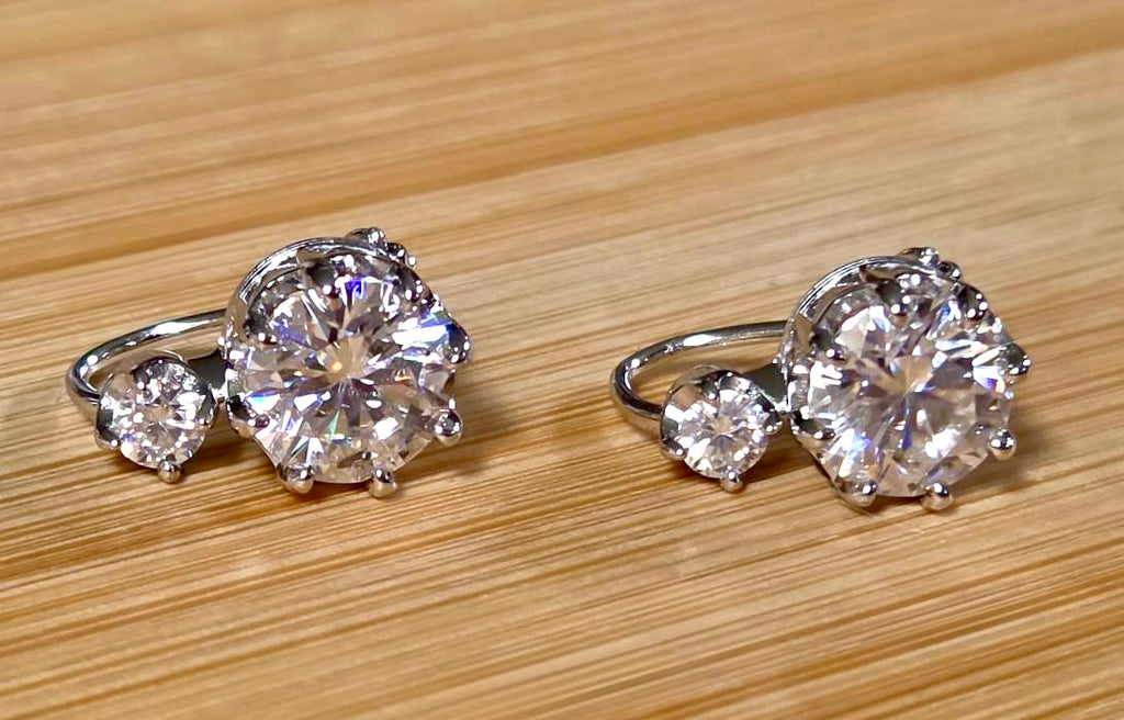 A Victorian inspired 4.2cttw certified pair of Moissanite 2-stone buckle back earrings in Argentium silver! Minimalist glam!