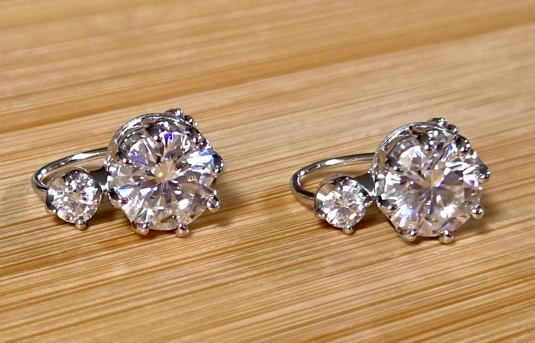 A Victorian inspired 4.2cttw certified pair of Moissanite 2-stone buckle back earrings in Argentium silver! Minimalist glam!