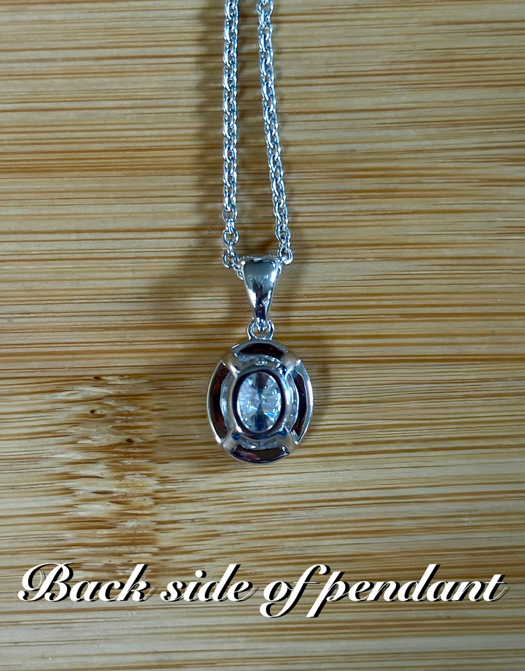 Moissanite solitaire necklace. A certified 5ct oval Moissanite in sterling silver and 18k!