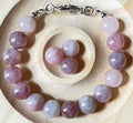 Madagascar rose quartz bracelet. Hands-down GORGEOUS AAA-grade 10.5mm purple-pink rose quartz beads and with varying degrees of crystallization and color!
