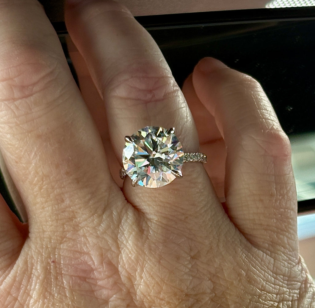 Moissanite solitaire. A glorious 10ct 8H8A Moissanite in a 4-prong mounting with a Moissanite “hidden halo” and shoulders, an 11.3cttw ring!