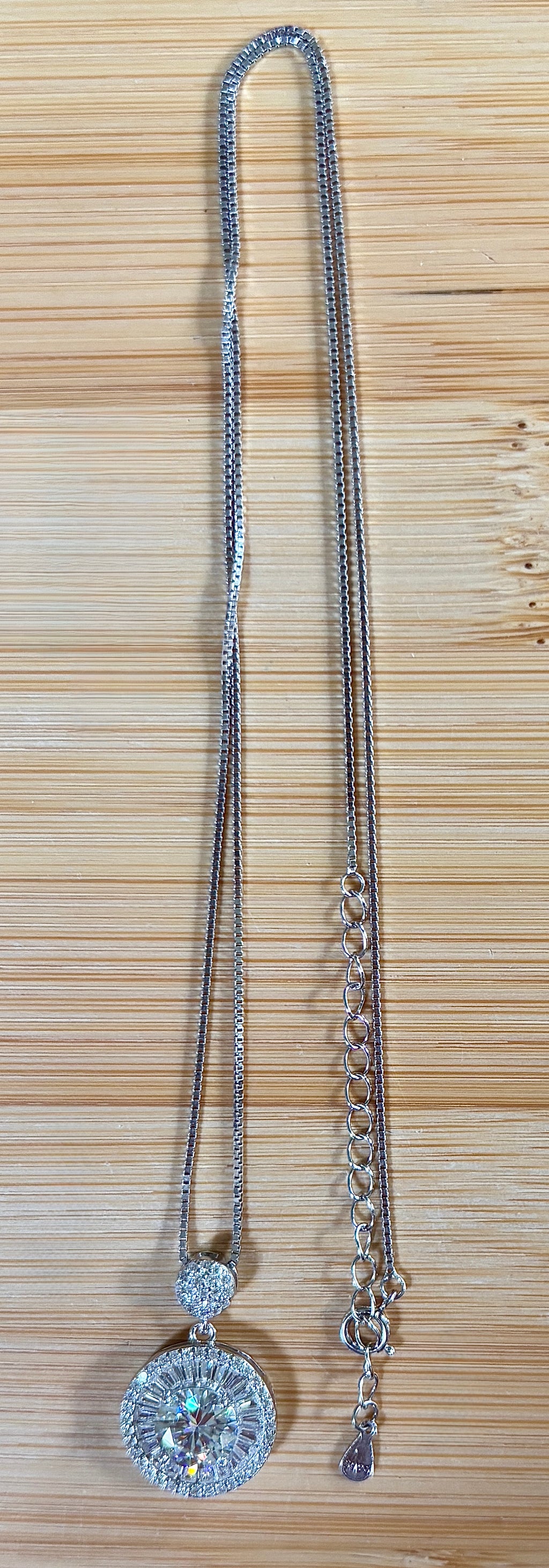 Moissanite necklace. The certified 2ct Moissanite “Sunburst” necklace with a 61 gemstone pendant plus more in the bail! Radiantly beautiful!