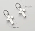 Small sterling silver cross charms, stainless steel double lobster clasps and stainless steel S-hooks for various jewelry applications.
