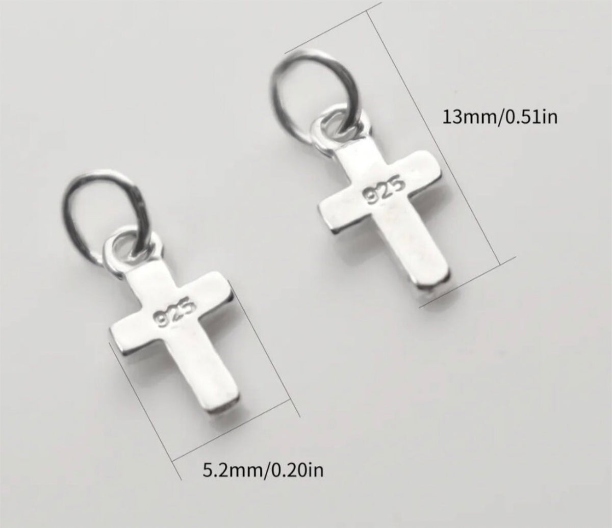 Small sterling silver cross charms, stainless steel double lobster clasps and stainless steel S-hooks for various jewelry applications.