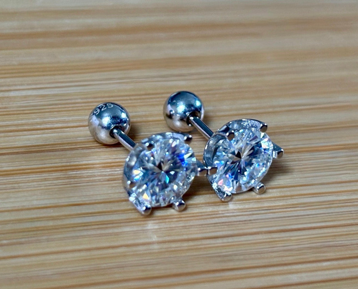 A certified pair of pretty, floral-inspired 2cttw or 4cttw Moissanite studs in poinsettia-shaped settings w/screwball backs OR 4cttw w/push backs!