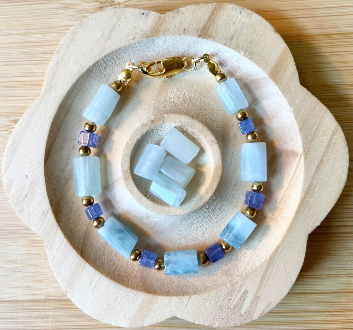 Aquamarine and tanzanite bracelet. The “True Blue” bracelet features trendy aquamarine barrels and dusky tanzanite cubes!