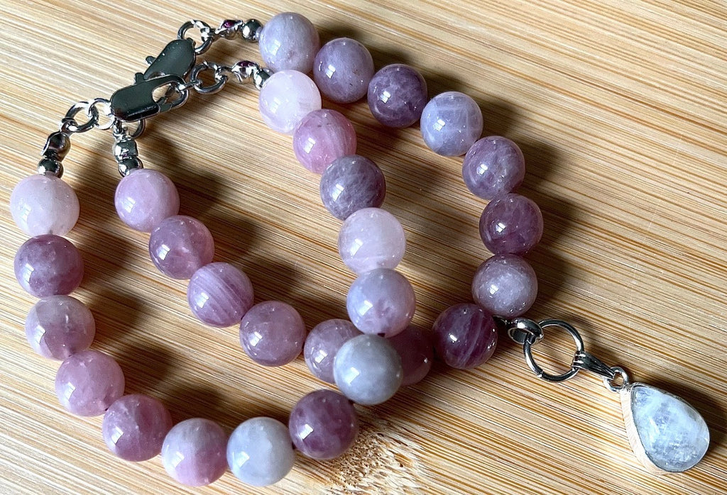 Madagascar rose quartz bracelet. Hands-down GORGEOUS AAA-grade 10.5mm purple-pink rose quartz beads and with varying degrees of crystallization and color!