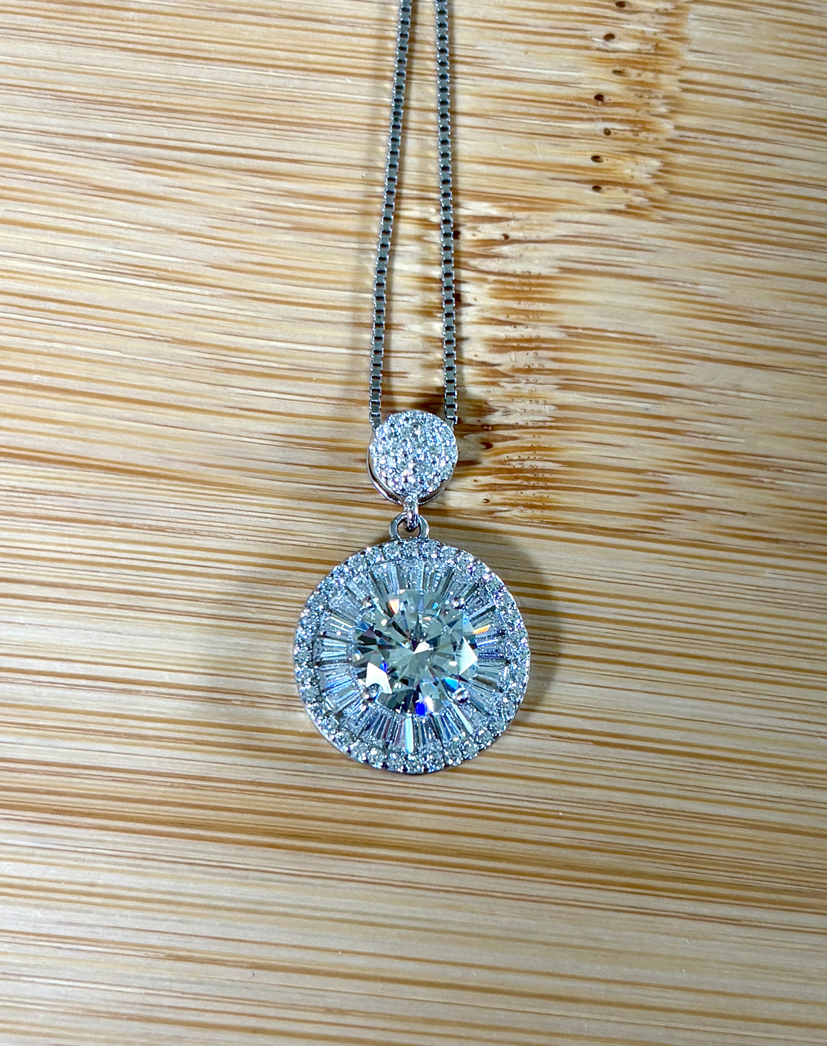 Moissanite necklace. The certified 2ct Moissanite “Sunburst” necklace with a 61 gemstone pendant plus more in the bail! Radiantly beautiful!