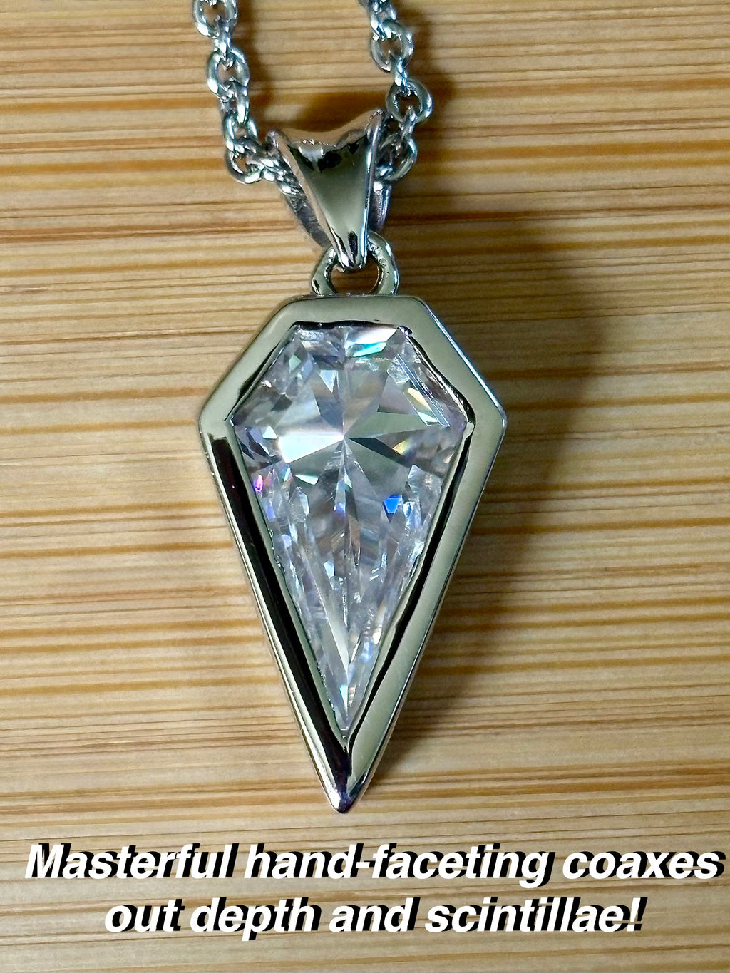 Moissanite necklace. “Flight!”, a kite-shaped, custom-cut 5ct Moissanite pendant! Hand-faceted by a master stone cutter and set in Argentium silver, it is suspended on a 20” sterling silver chain and is exclusive to Hand Knotted Jewelry!