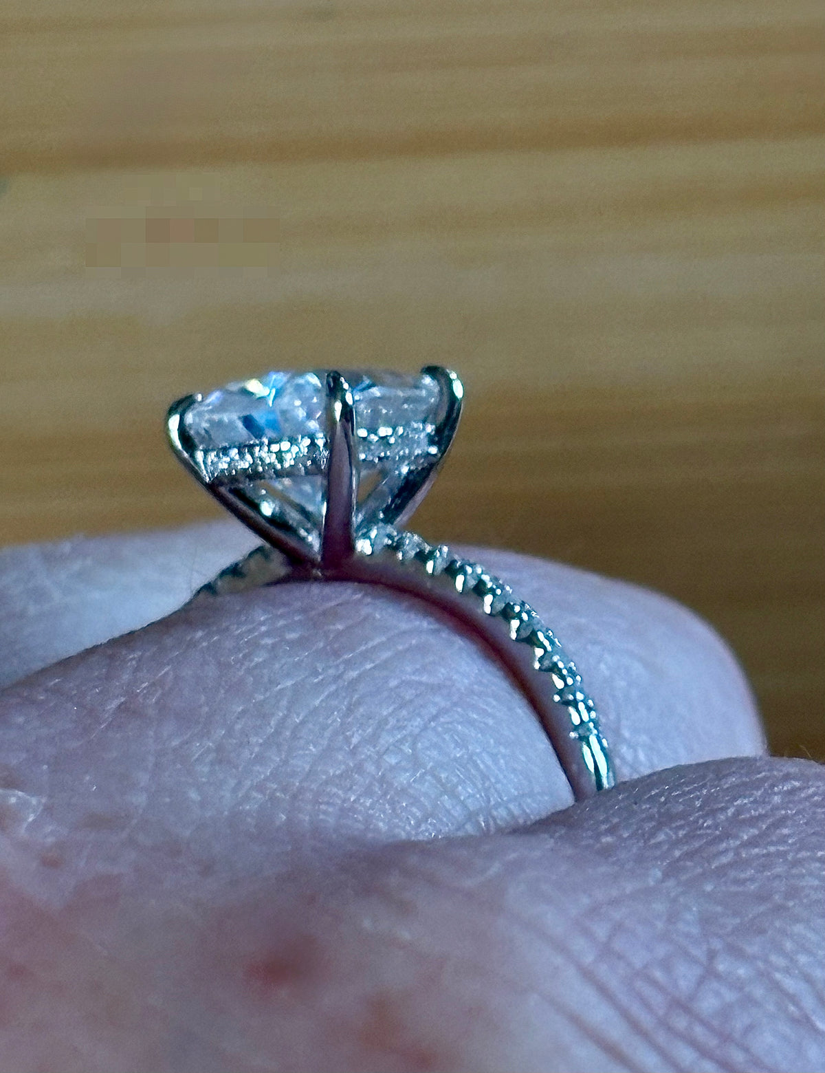 A certified 5ct pear-cut Moissanite solitaire in 925 sterling OR 935 Argentium silver with 18k, with pavé-set Moissanite shoulders and Moissanite hidden halo!