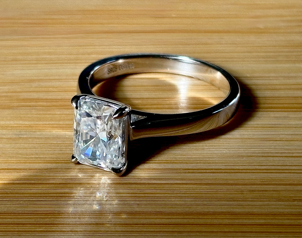A certified Moissanite 3ct radiant solitaire! An UBER flashy, ULTRA classy, contemporary and chic radiant-cut engagement ring!