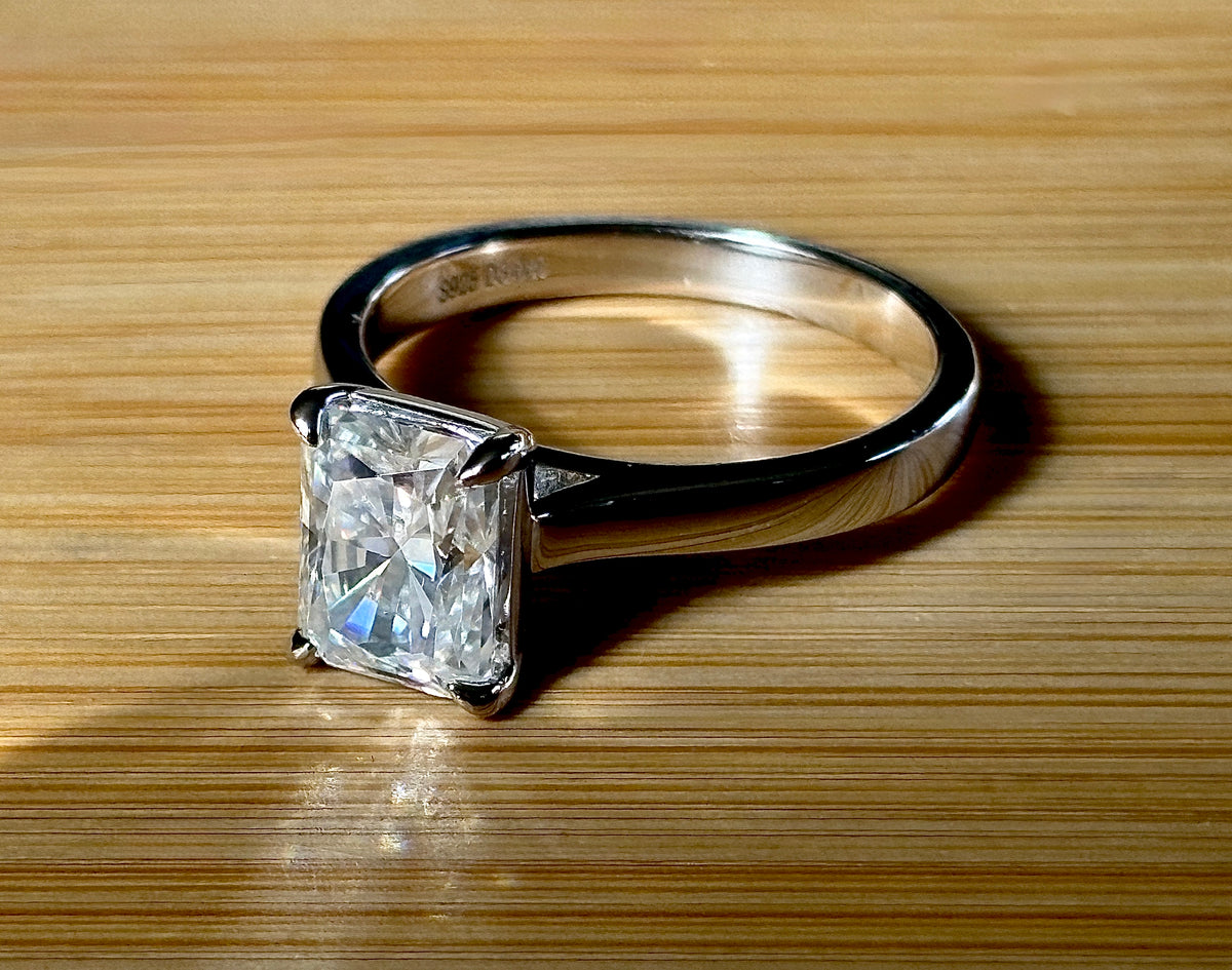 A certified Moissanite 3ct radiant solitaire! An UBER flashy, ULTRA classy, contemporary and chic radiant-cut engagement ring!