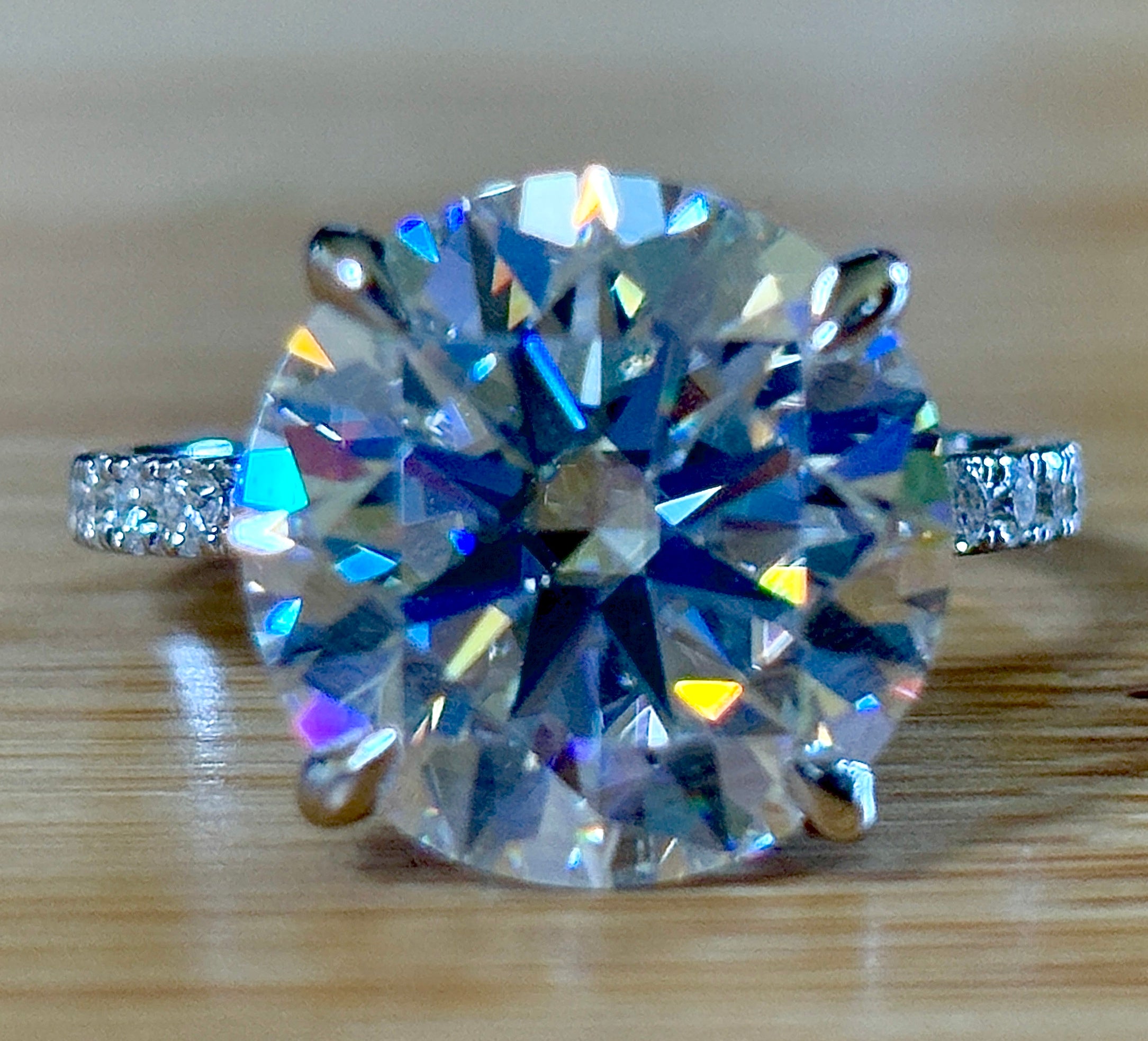 Moissanite solitaire. A glorious 10ct 8H8A Moissanite in a 4-prong mounting with a Moissanite “hidden halo” and shoulders, an 11.3cttw ring!