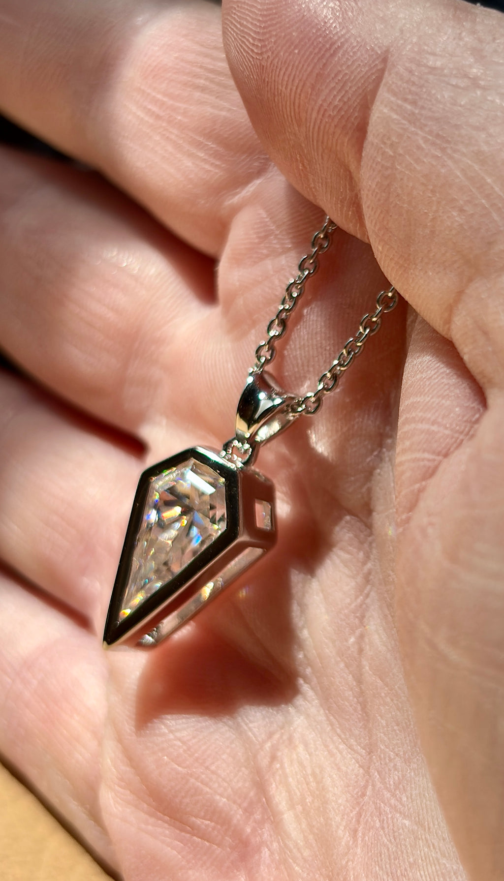 Moissanite necklace. “Flight!”, a kite-shaped, custom-cut 5ct Moissanite pendant! Hand-faceted by a master stone cutter and set in Argentium silver, it is suspended on a 20” sterling silver chain and is exclusive to Hand Knotted Jewelry!