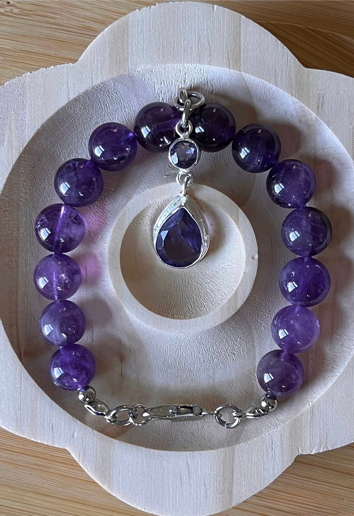 Amethyst bracelet. Natural and vibrant 10mm amethyst beads and stainless steel! The amethyst pendant in solid sterling silver is optional.