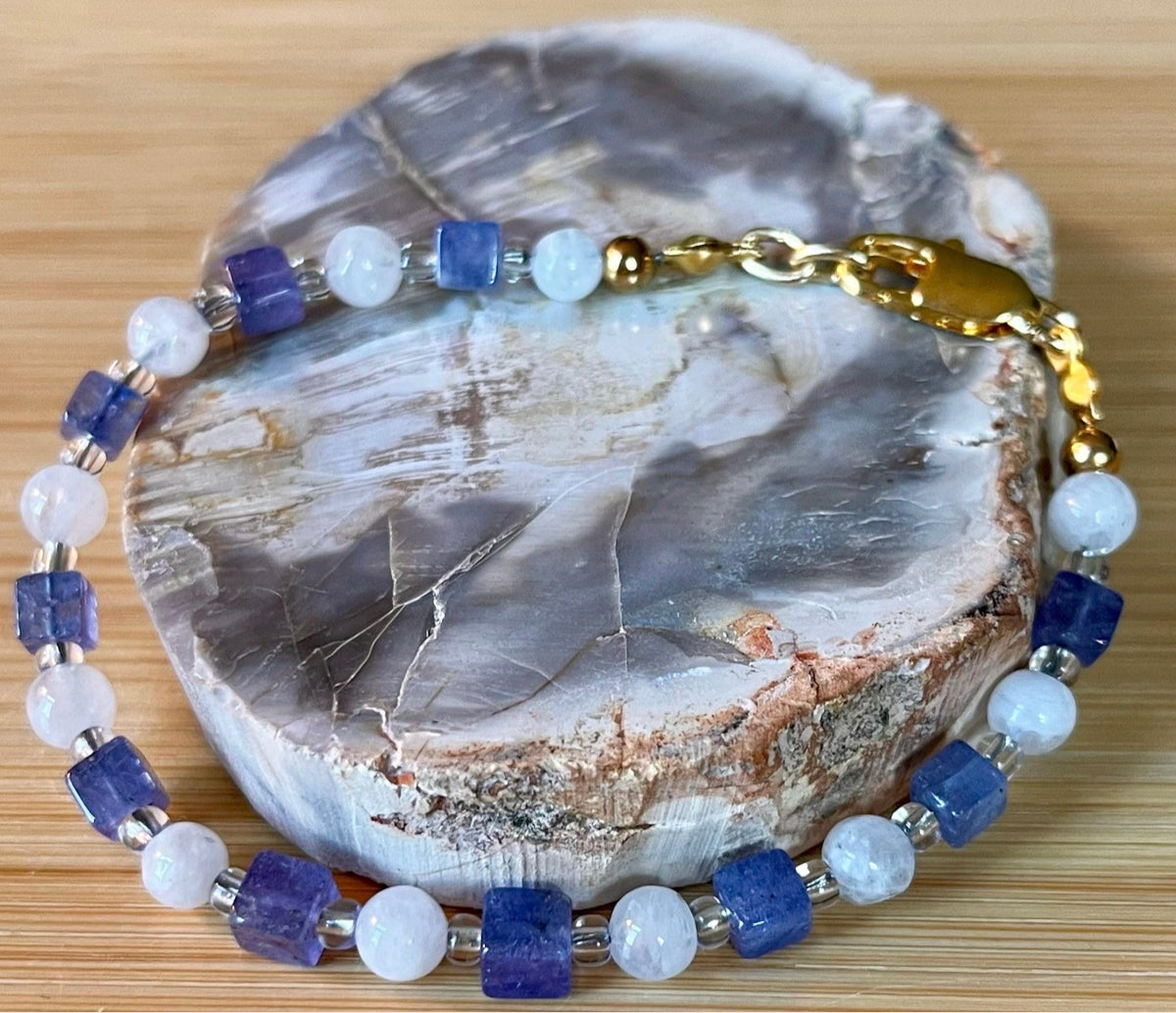 Moonstone and tanzanite bracelet. Dusky tanzanite cubes and round moonstones on stainless steel jeweler’s wire! Pretty and petite!