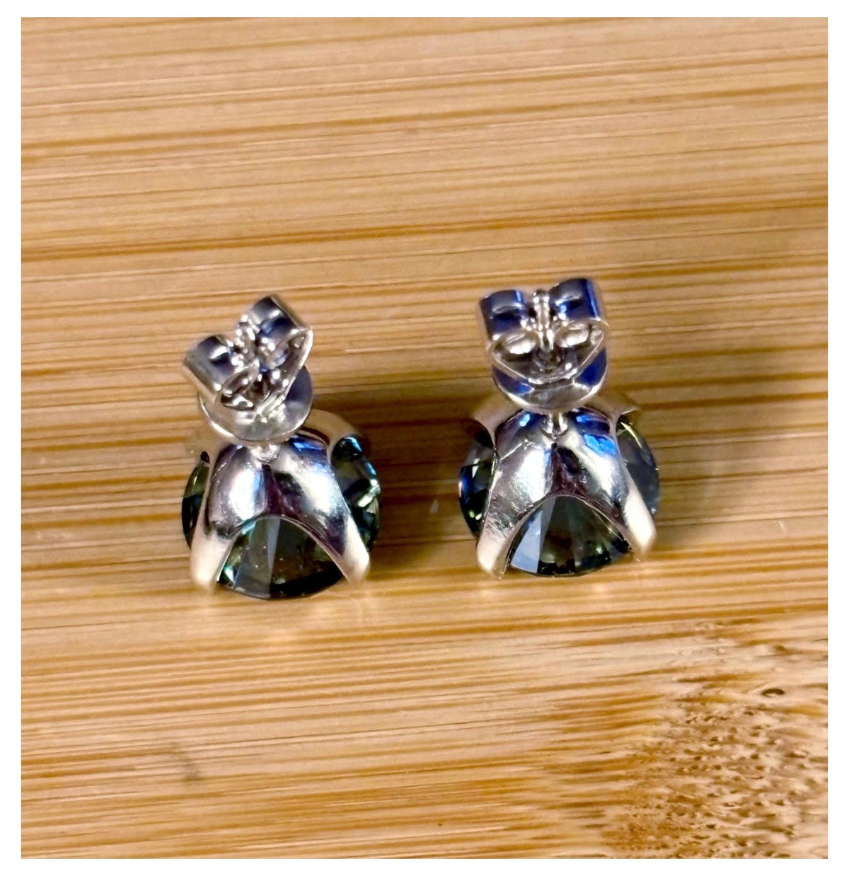 Moissanite studs. A 2cttw or 6cttw pair of cyan (greenish-blue) Moissanite studs. Double certified and rich in color, they are delicious!