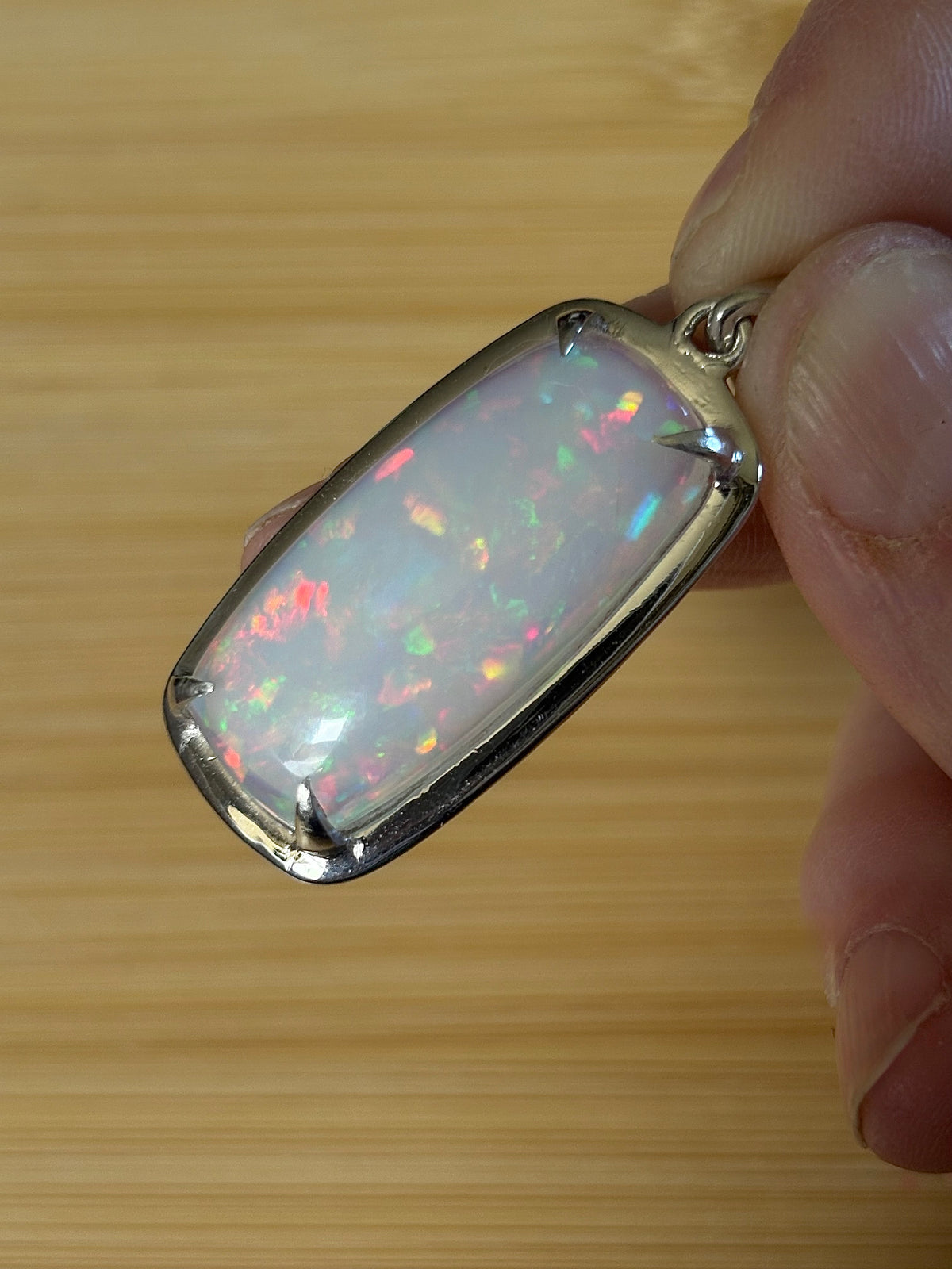 A 21ct AAA grade Ethiopian opal pendant, a handpicked opal and exclusive HKJ design! This lovely opal has gorgeous fire and play of color!