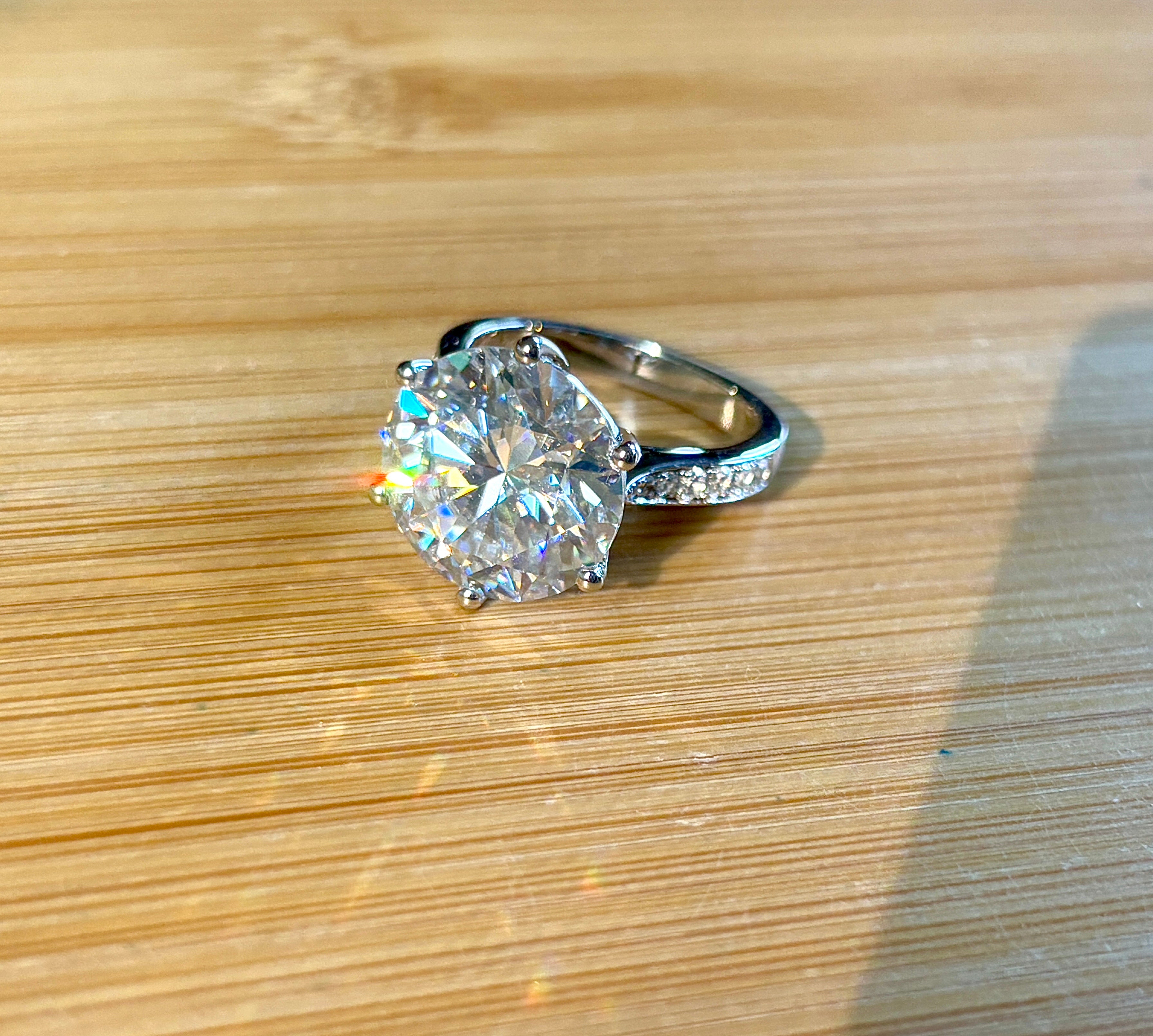 Moissanite ring. The 10ct certified 8H8A Moissanite “Tulip” statement ring with .50cttw Moissanite accents! Photos fail this GORGEOUS ring!