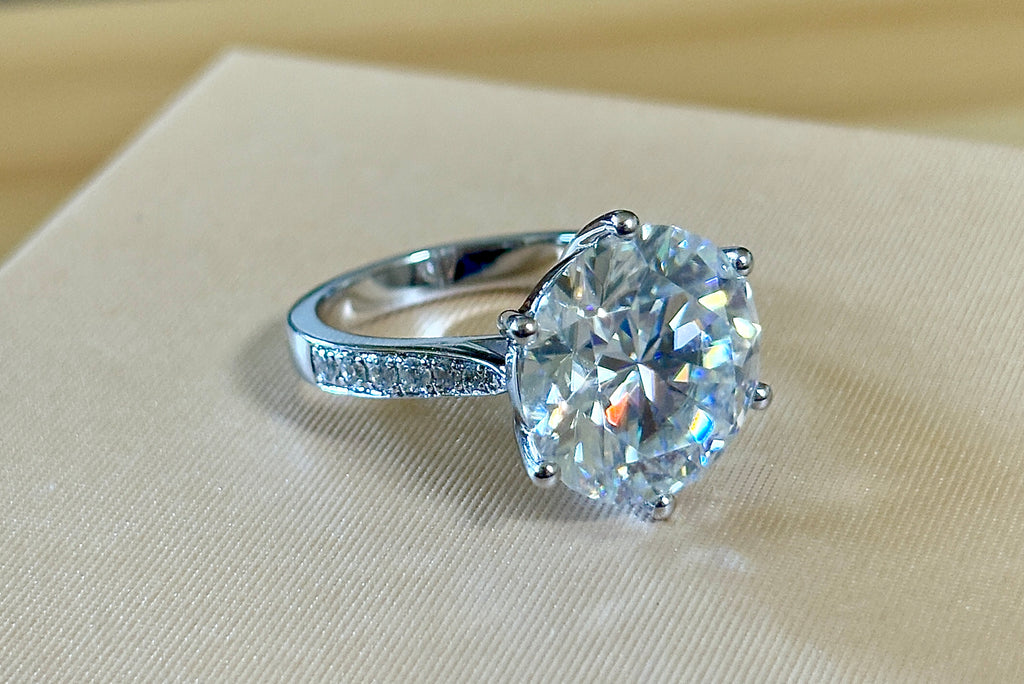 Moissanite ring. The 10ct certified 8H8A Moissanite “Tulip” statement ring with .50cttw Moissanite accents! Photos fail this GORGEOUS ring!