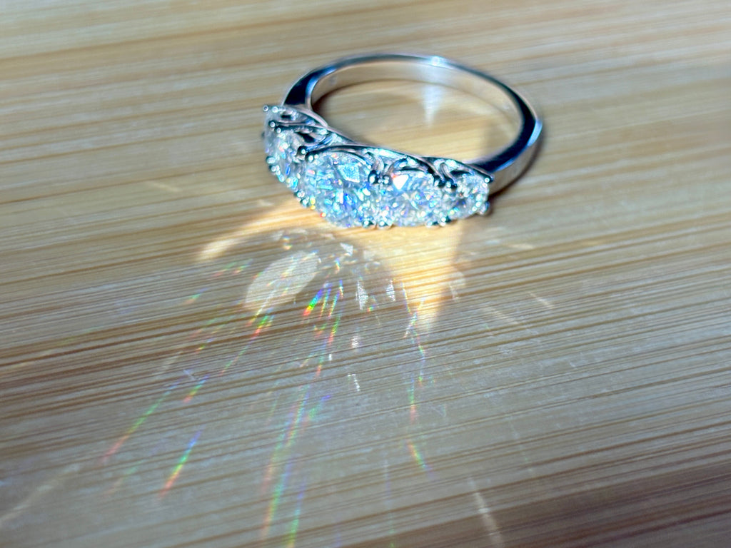 Moissanite ring. A 2.5ctw certified Moissanite ring, for those who want plenty of sparkle but a daintier ring! This feminine 5-stone design is just the thing!