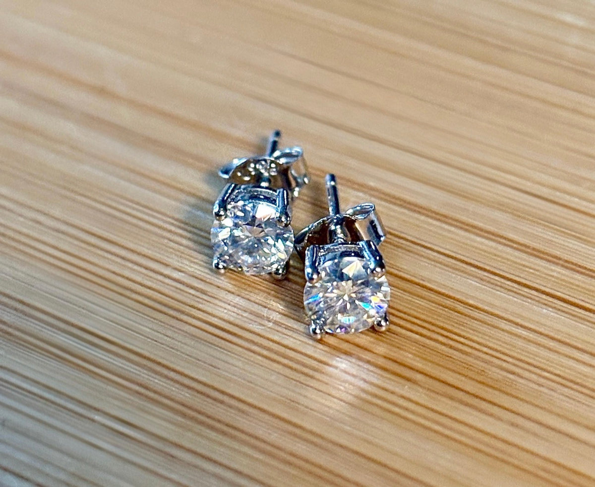 1cttw DOUBLE certified Moissanite studs with D-color and VVS1 clarity! Set in sterling silver bathed in 18k white gold, they’re a cut above!