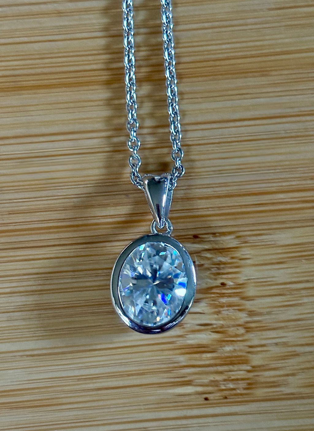 Moissanite solitaire necklace. A certified 5ct oval Moissanite in sterling silver and 18k!