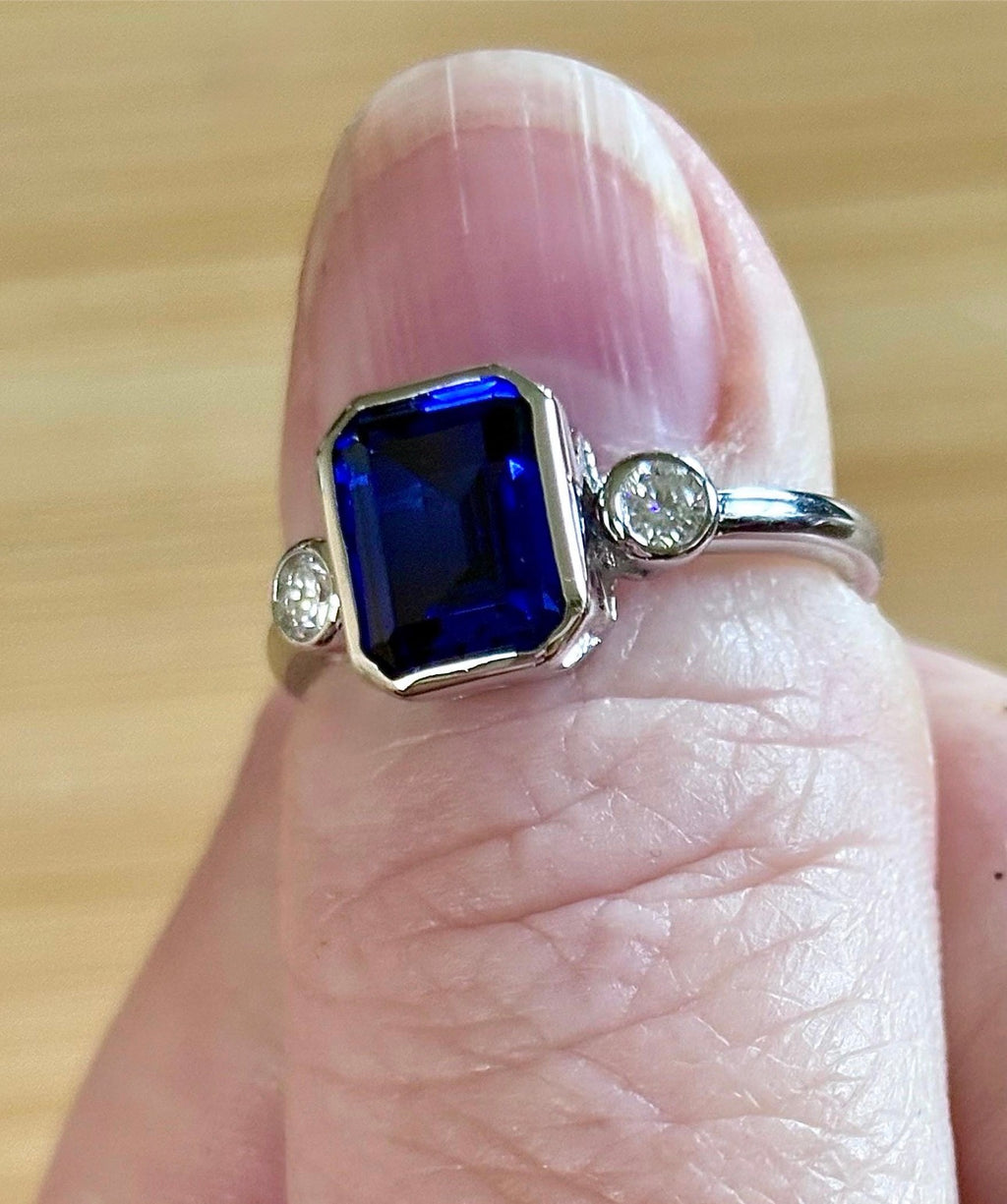 Blue sapphire and Moissanite ring. A certified 3ct lab-grown emerald-cut sapphire and .20ctw Moissanite ring in 925 sterling OR 935 Argentium!
