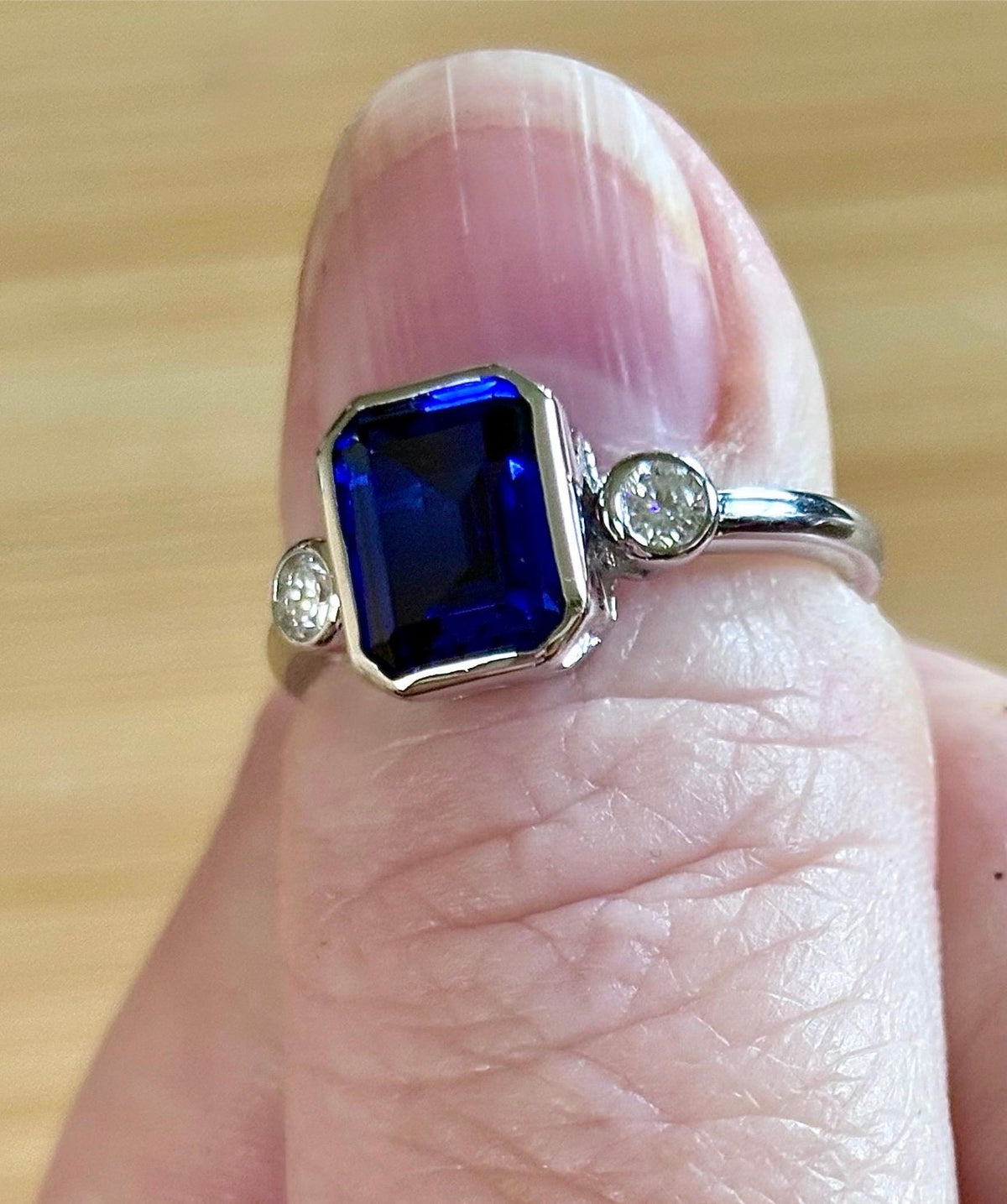 Blue sapphire and Moissanite ring. A certified 3ct lab-grown emerald-cut sapphire and .20ctw Moissanite ring in 925 sterling OR 935 Argentium!
