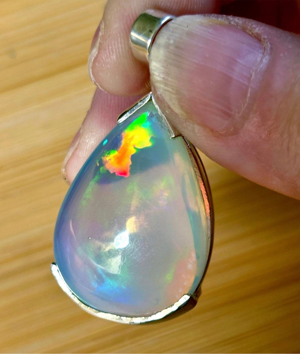 The “After the Storm” Ethiopian opal pendant, 39.18ct with rare “rolling” fire and spectacular play of color! **Collector’s grade** AAAA++