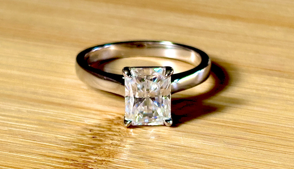 A certified Moissanite 3ct radiant solitaire! An UBER flashy, ULTRA classy, contemporary and chic radiant-cut engagement ring!
